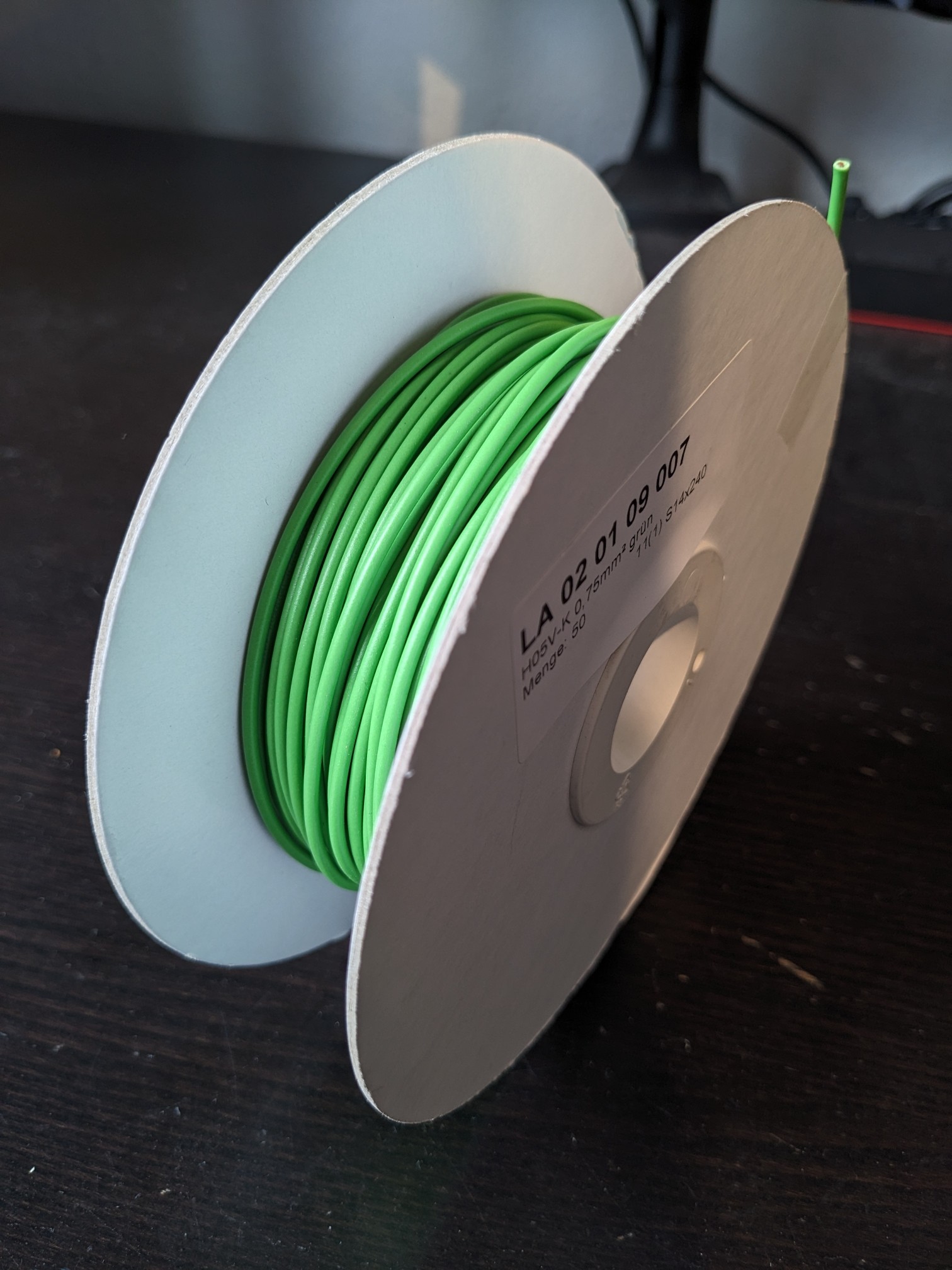 A big roll of green wire.